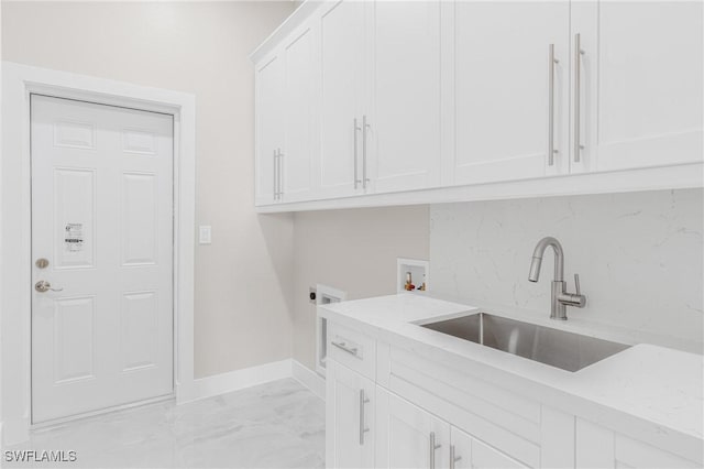 laundry room featuring sink, hookup for a washing machine, cabinets, and hookup for an electric dryer