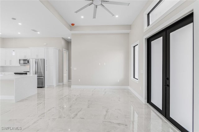 interior space featuring french doors and ceiling fan