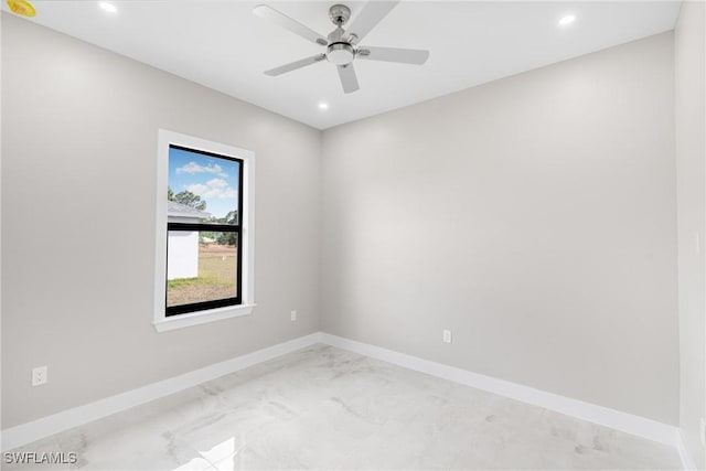 spare room with ceiling fan