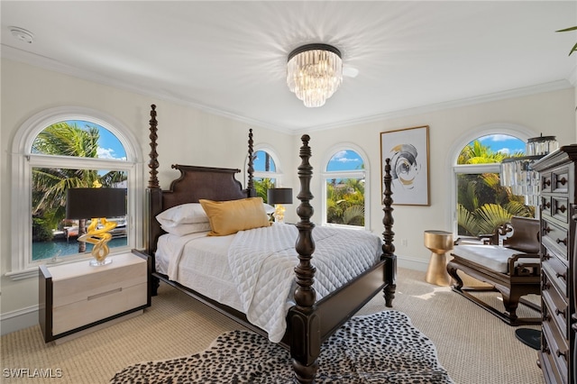 bedroom with baseboards, a notable chandelier, light colored carpet, and crown molding