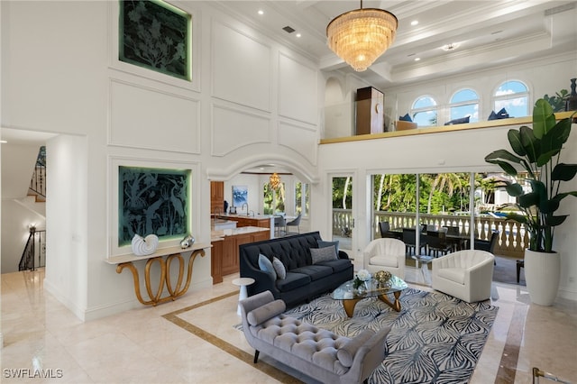 living area with recessed lighting, crown molding, a towering ceiling, and baseboards