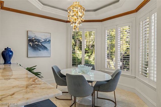 dining room with plenty of natural light, a raised ceiling, and crown molding