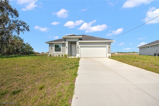 view of front of house featuring stucco siding, driveway, an attached garage, and a front yard