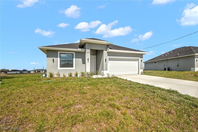 view of front of property with a garage, concrete driveway, a front yard, and stucco siding