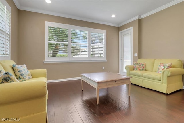 living room with dark wood-type flooring and crown molding