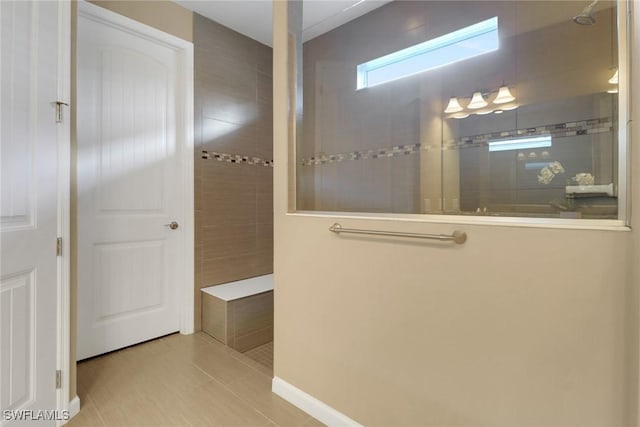 bathroom with a tile shower