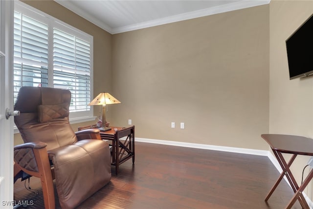 living area with crown molding and dark hardwood / wood-style flooring