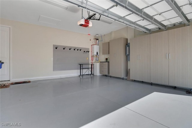 garage featuring water heater and a garage door opener