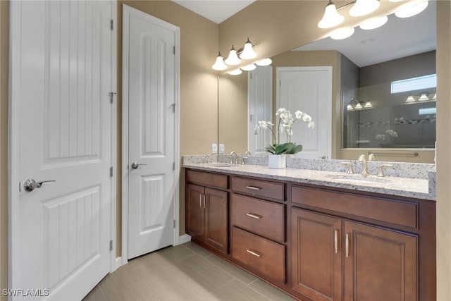 bathroom with vanity, tile patterned flooring, and walk in shower