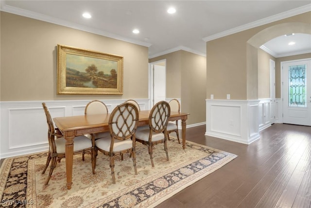 dining area featuring crown molding and dark hardwood / wood-style floors