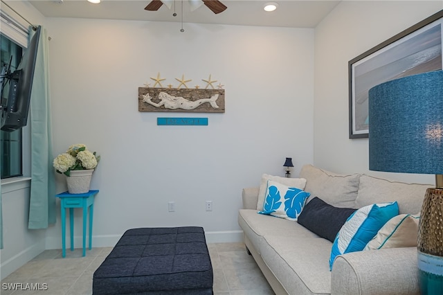 tiled living room featuring ceiling fan