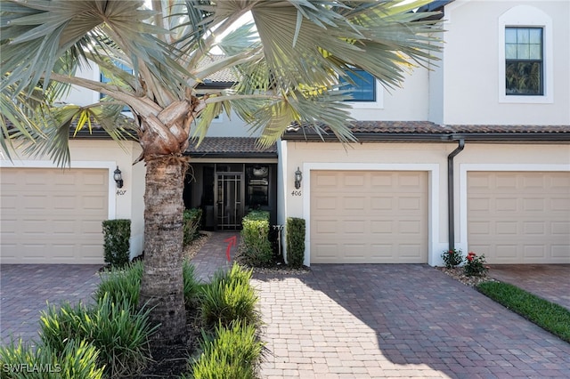 view of front of property with a garage