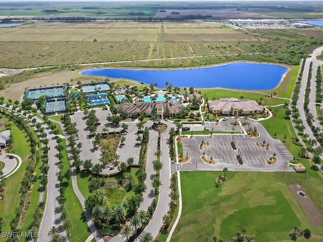 birds eye view of property featuring a rural view and a water view