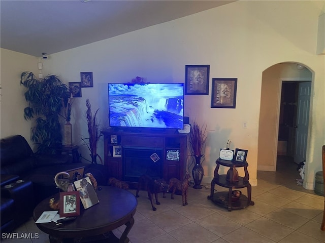 tiled living room with lofted ceiling