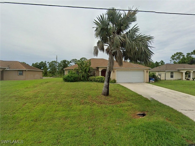 view of front of home featuring a garage and a front lawn