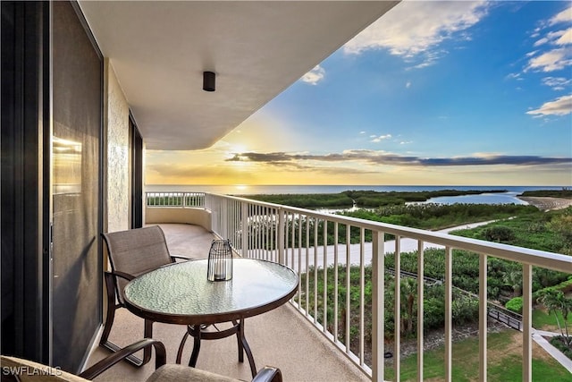 balcony at dusk with a water view