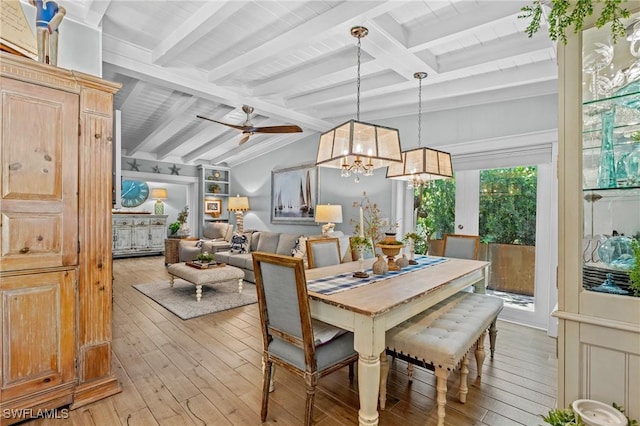dining room with light wood finished floors, vaulted ceiling with beams, and ceiling fan with notable chandelier