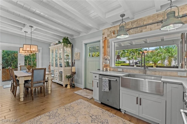 840 Myrtle Ter, Naples, FL 34103 - kitchen with dishwasher, healthy amount of natural light, light wood finished floors, and light countertops