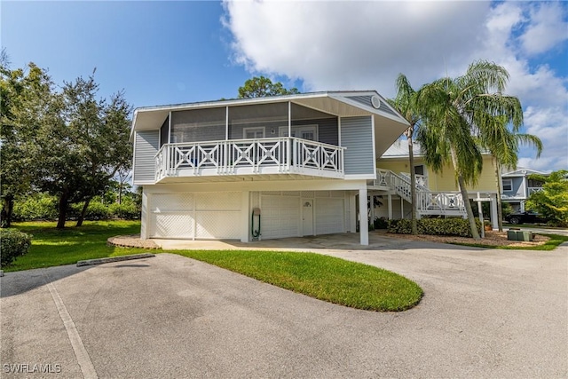 view of front of property with a garage and a front yard