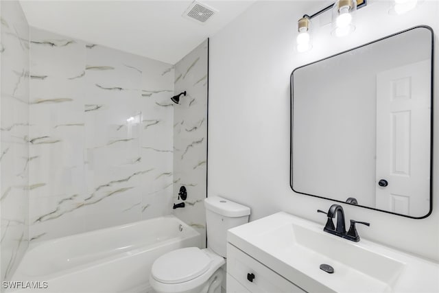 full bathroom with tiled shower / bath, vanity, and toilet