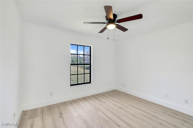 empty room with light hardwood / wood-style floors and ceiling fan