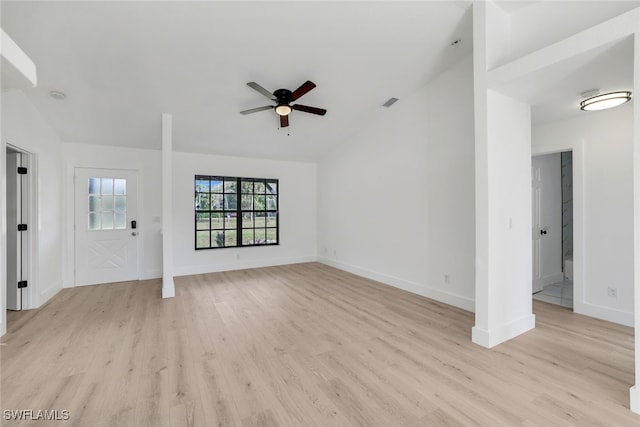 unfurnished living room with lofted ceiling, ceiling fan, and light hardwood / wood-style flooring