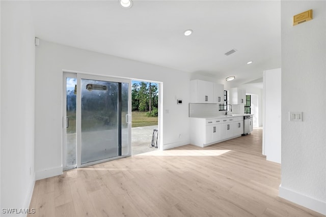 interior space with sink and light hardwood / wood-style floors