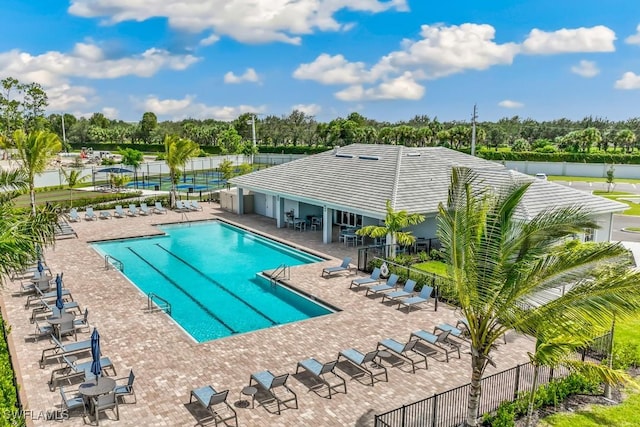 view of swimming pool with a patio area