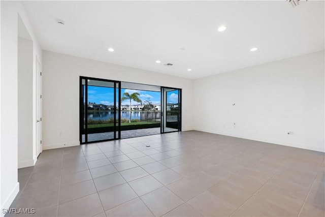 spare room featuring recessed lighting, visible vents, baseboards, and light tile patterned floors