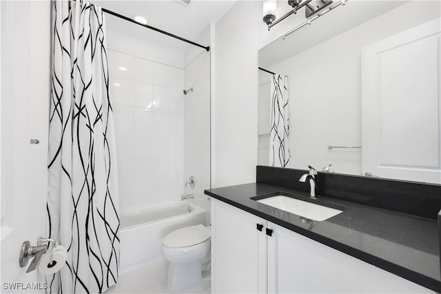 bathroom with vanity, shower / bath combination with curtain, and toilet