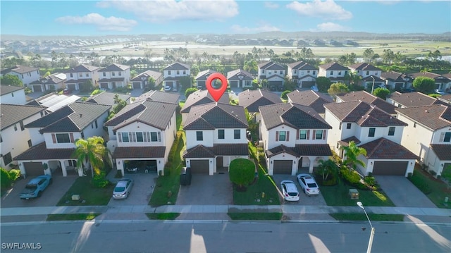 birds eye view of property featuring a mountain view