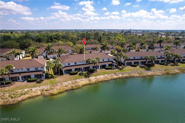 aerial view with a water view and a residential view