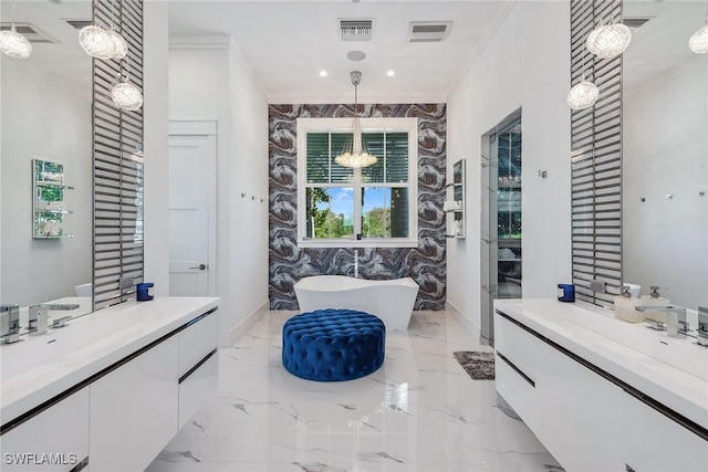 bathroom featuring a freestanding tub, visible vents, marble finish floor, an inviting chandelier, and crown molding