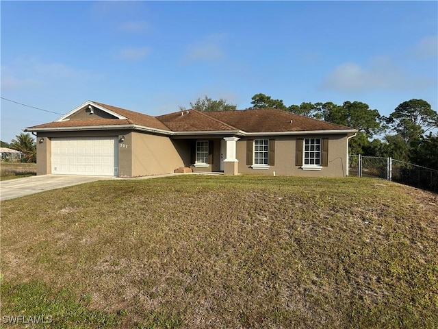 ranch-style home featuring a garage and a front yard