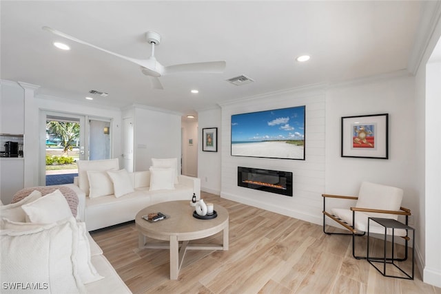 418 Germain Ave, Naples, FL 34108 - living room with crown molding, a fireplace, recessed lighting, light wood-type flooring, and a ceiling fan