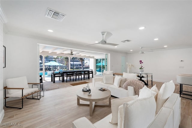 418 Germain Ave, Naples, FL 34108 - living room featuring crown molding, a ceiling fan, light wood-style floors, recessed lighting, and baseboards