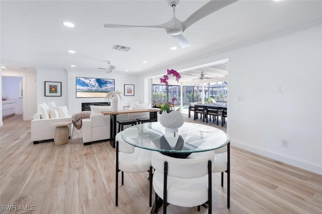 418 Germain Ave, Naples, FL 34108 - dining area with baseboards, ceiling fan, light wood finished floors, and recessed lighting