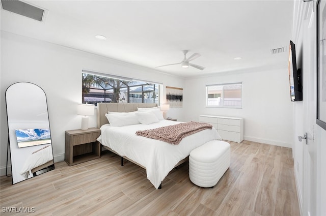 418 Germain Ave, Naples, FL 34108 - bedroom featuring multiple windows, light wood-type flooring, baseboards, crown molding, and recessed lighting