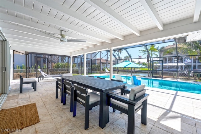 418 Germain Ave, Naples, FL 34108 - swimming pool featuring a patio, glass enclosure, a ceiling fan, and outdoor dining area