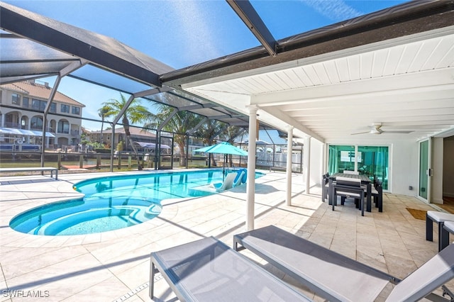 418 Germain Ave, Naples, FL 34108 - outdoor pool featuring a patio area, ceiling fan, glass enclosure, and outdoor dining space