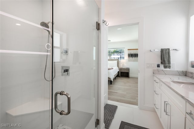 418 Germain Ave, Naples, FL 34108 - full bathroom with ensuite bathroom, vanity, a stall shower, and tile patterned floors