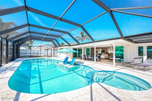 view of swimming pool featuring a patio area, a lanai, and a fenced in pool