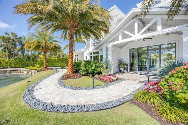 doorway to property with a yard