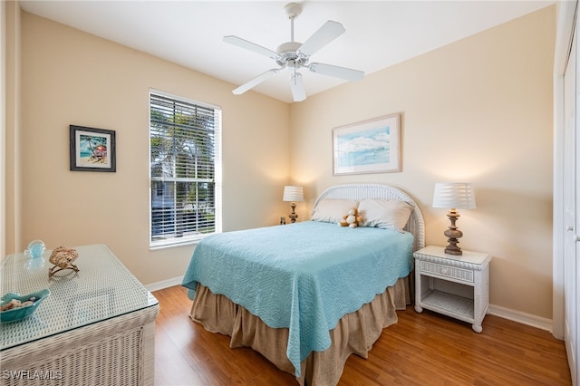12206 Siesta Dr, Fort Myers Beach, FL 33931 - bedroom featuring wood finished floors and a ceiling fan