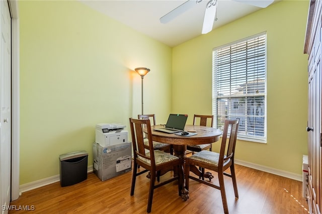 12206 Siesta Dr, Fort Myers Beach, FL 33931 - dining area with wood finished floors and ceiling fan