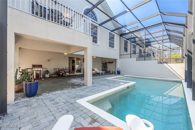 12206 Siesta Dr, Fort Myers Beach, FL 33931 - outdoor pool with area for grilling, a patio, and a lanai