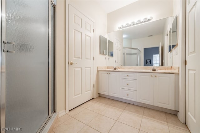 12206 Siesta Dr, Fort Myers Beach, FL 33931 - full bath with a shower stall, double vanity, and tile patterned flooring