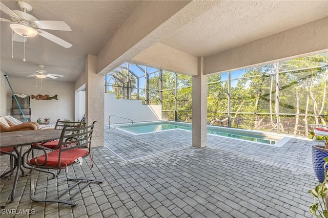 12206 Siesta Dr, Fort Myers Beach, FL 33931 - outdoor pool featuring ceiling fan, a patio area, and glass enclosure