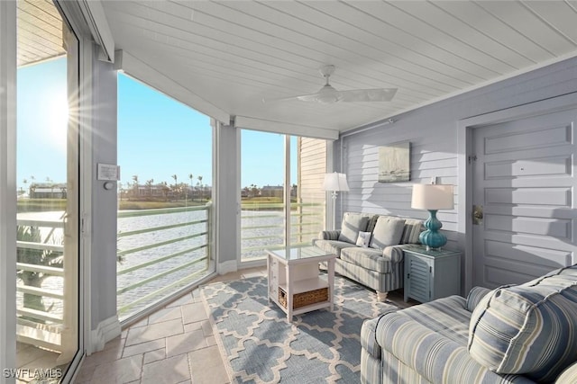 sunroom with a ceiling fan