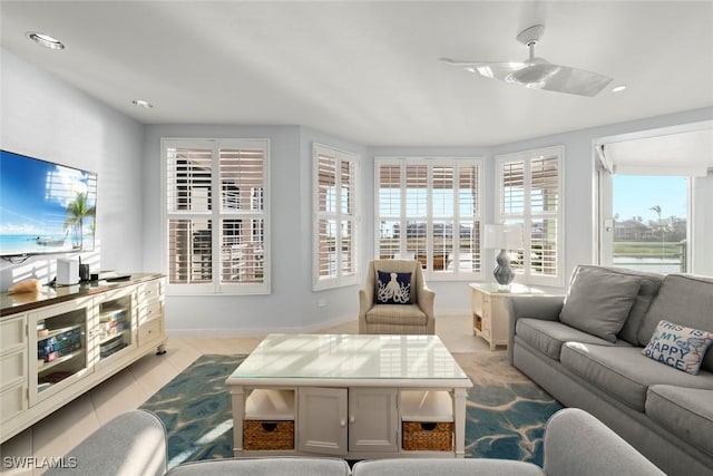 living room with baseboards, ceiling fan, recessed lighting, and tile patterned floors